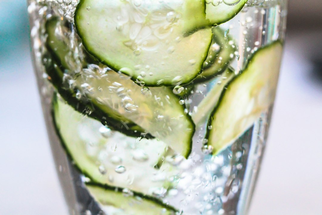 Cold water with cucumber slices for hydration
